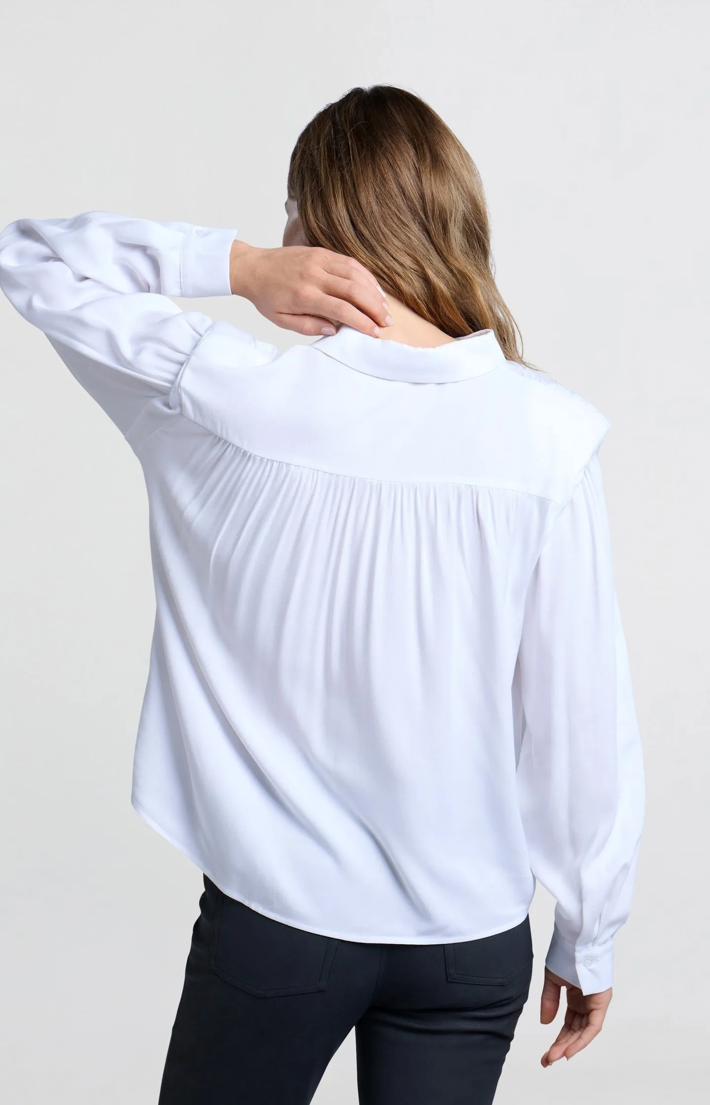 Blouse with long sleeves, buttons and shoulder pads